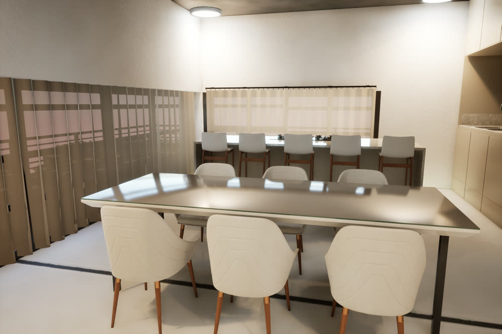 Dining room with a long table and white chairs, the kitchen counter and bar stools behind it, and full-height curtains.